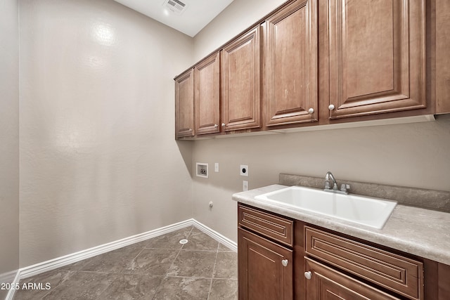 laundry area featuring visible vents, washer hookup, cabinet space, electric dryer hookup, and a sink