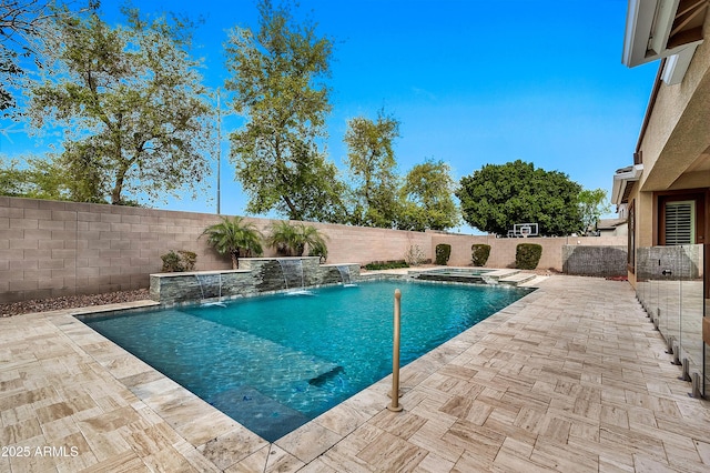 view of pool with a patio, a pool with connected hot tub, and a fenced backyard