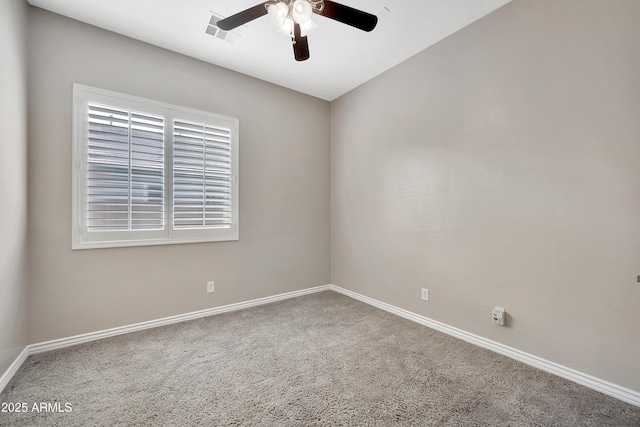 unfurnished room featuring carpet, a ceiling fan, visible vents, and baseboards