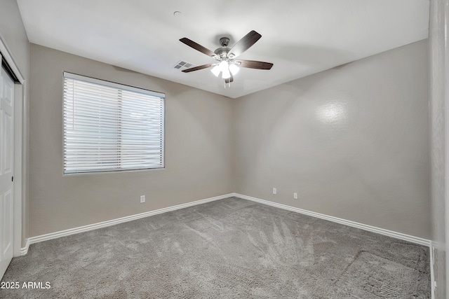 unfurnished room featuring visible vents, baseboards, ceiling fan, and carpet flooring