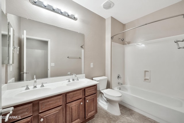 bathroom with a sink, shower / bath combination, toilet, and double vanity