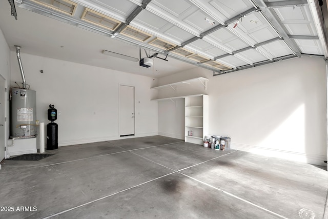 garage with a garage door opener, water heater, and baseboards