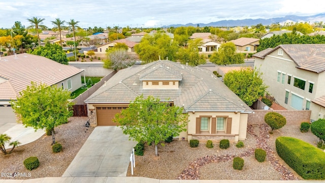 drone / aerial view featuring a residential view and a mountain view