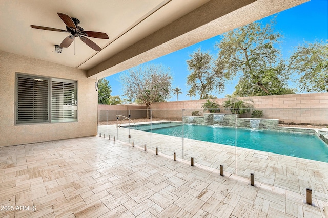 view of swimming pool with ceiling fan, a patio, a fenced backyard, and a fenced in pool