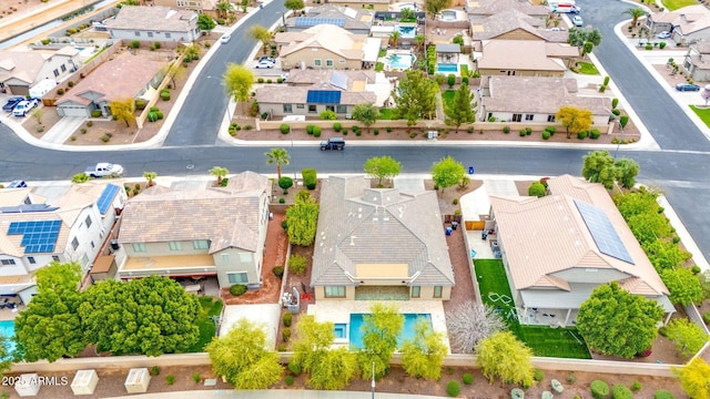 birds eye view of property with a residential view