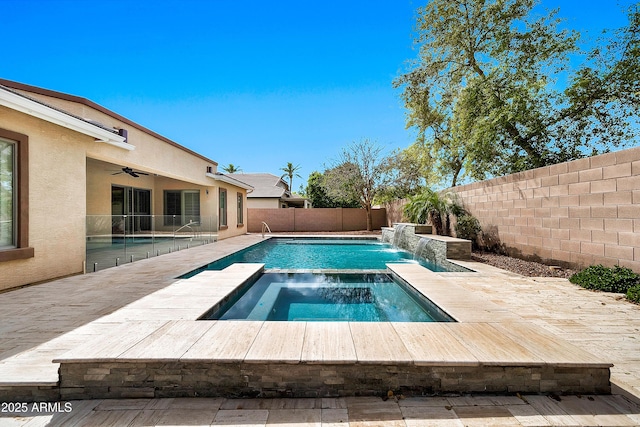 view of pool with a patio, a fenced in pool, an in ground hot tub, a fenced backyard, and ceiling fan