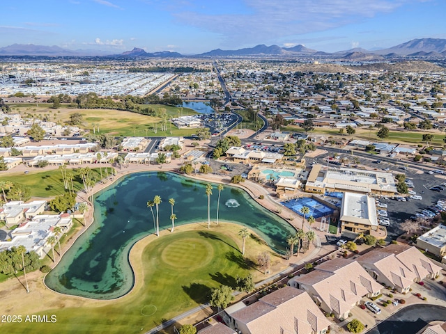 drone / aerial view with a water and mountain view