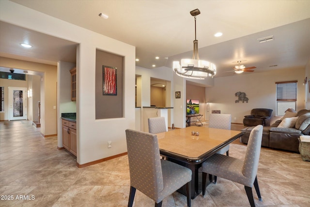 dining room featuring ceiling fan with notable chandelier, baseboards, visible vents, and recessed lighting