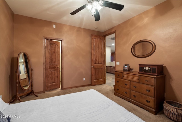 bedroom with a ceiling fan, baseboards, and light colored carpet