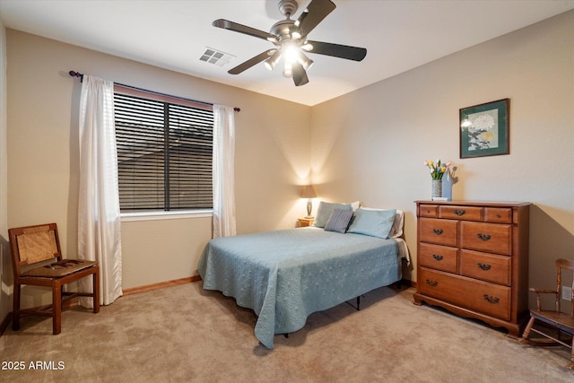 bedroom with visible vents, baseboards, a ceiling fan, and light carpet
