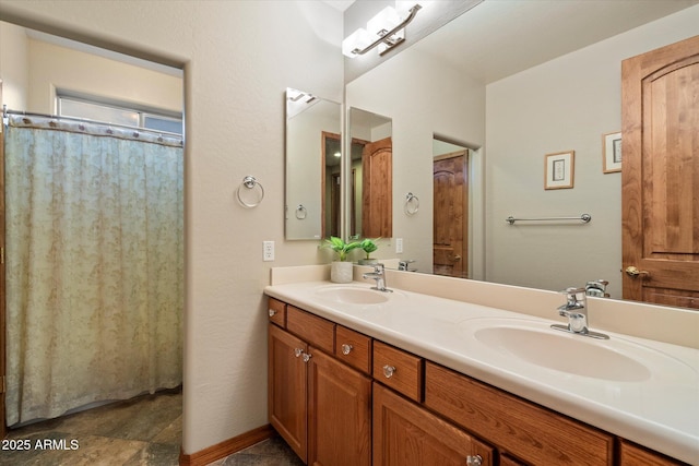 bathroom featuring double vanity and a sink