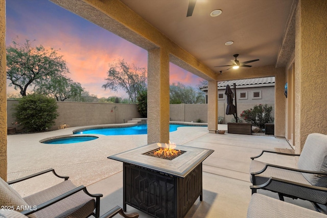 view of swimming pool featuring a fenced backyard, a patio area, a fenced in pool, and a fire pit