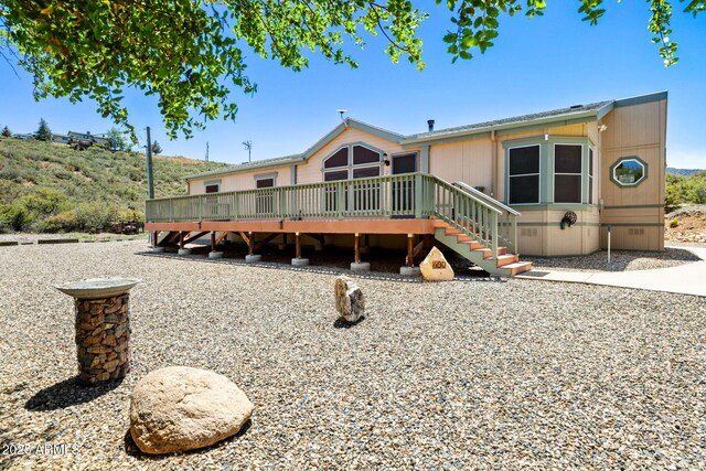 490 S Hideaway Dr, Dewey, AZ 86327 - back of property featuring a wooden deck, crawl space, and stairway