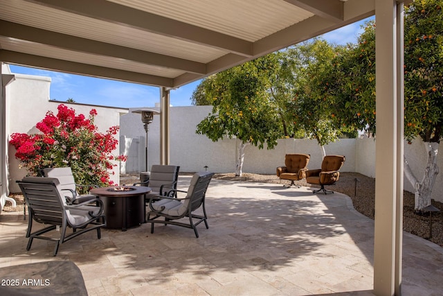 view of patio with an outdoor fire pit