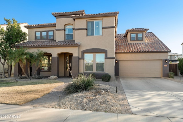 mediterranean / spanish-style home featuring a garage