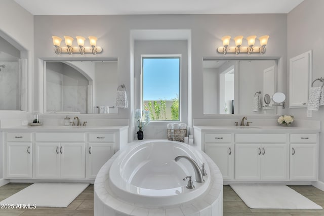 11934 S 181st Ave, Goodyear, AZ 85338 - bathroom featuring a sink, a bath, and two vanities