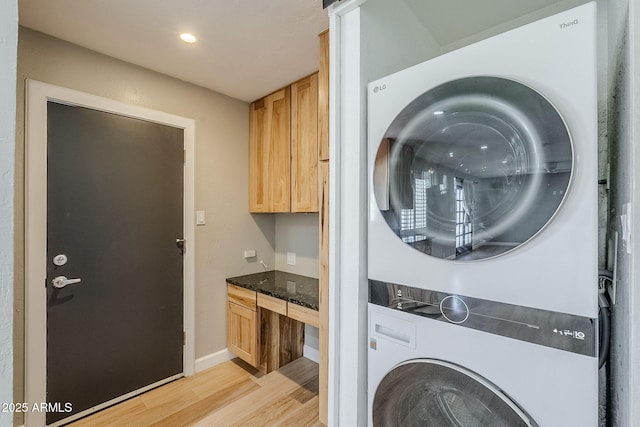 3138 N 82nd Pl, Scottsdale, AZ 85251 - laundry room with baseboards, stacked washer and dryer, recessed lighting, light wood-style flooring, and laundry area
