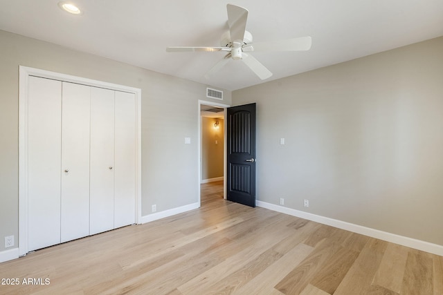 3138 N 82nd Pl, Scottsdale, AZ 85251 - unfurnished bedroom with a closet, baseboards, visible vents, a ceiling fan, and light wood-style flooring