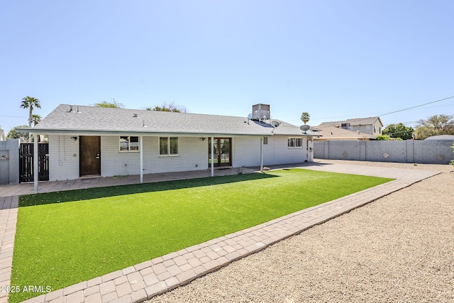 3138 N 82nd Pl, Scottsdale, AZ 85251 - rear view of property featuring a patio area, fence, a lawn, and roof with shingles