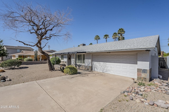 3138 N 82nd Pl, Scottsdale, AZ 85251 - view of front of property with a garage, a shingled roof, and concrete driveway