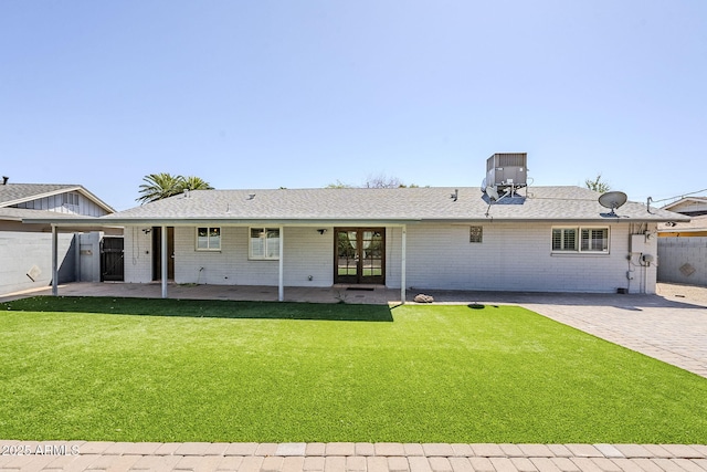 3138 N 82nd Pl, Scottsdale, AZ 85251 - rear view of property featuring cooling unit, a yard, a patio area, fence, and brick siding