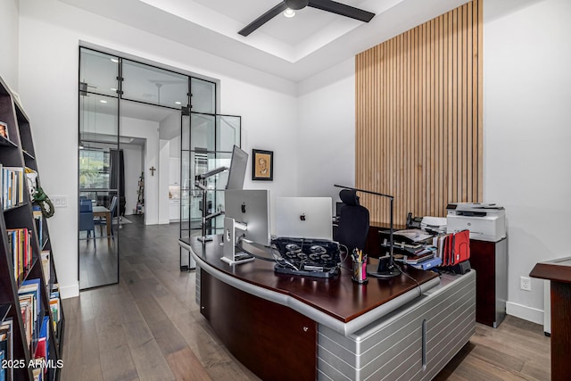 office with ceiling fan, wood finished floors, and baseboards