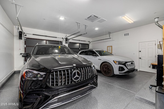 garage with visible vents and baseboards