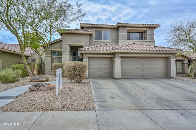 mediterranean / spanish-style home with a garage