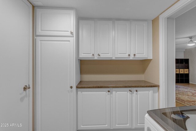 kitchen featuring white cabinetry