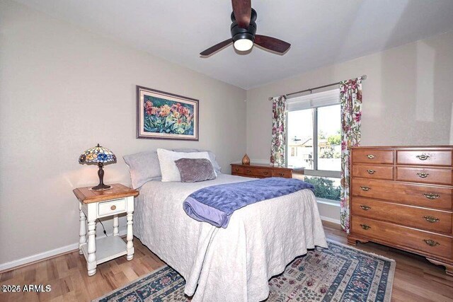 bedroom featuring ceiling fan and wood-type flooring