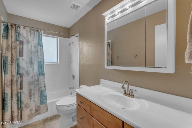 full bathroom with tile patterned floors, shower / tub combo, vanity, and toilet