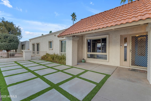 back of property featuring a patio