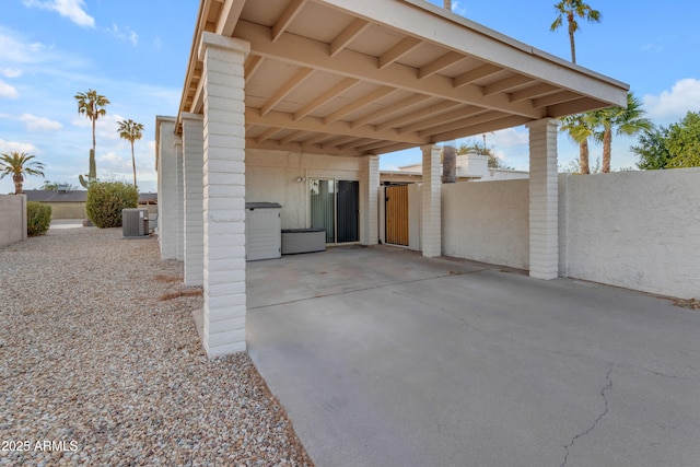 view of patio featuring a carport and cooling unit