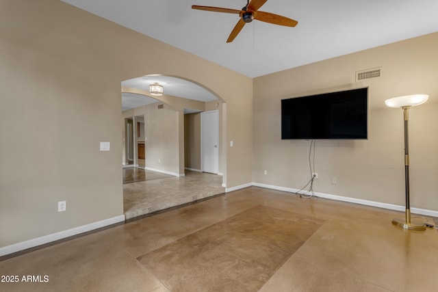 unfurnished living room featuring concrete flooring and ceiling fan