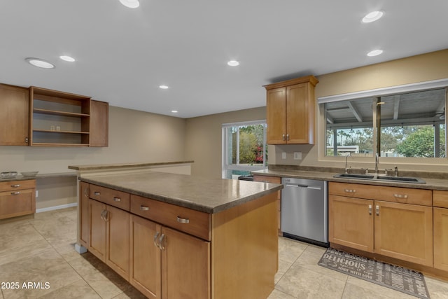 kitchen featuring sink, a kitchen island, light tile patterned flooring, and dishwasher