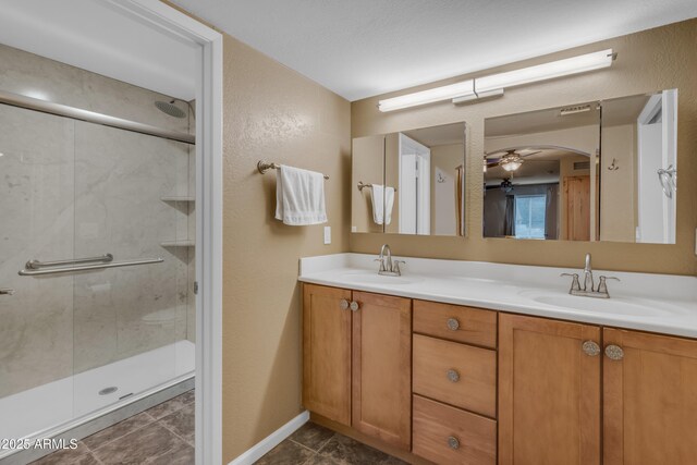 bathroom featuring vanity and a shower with shower door