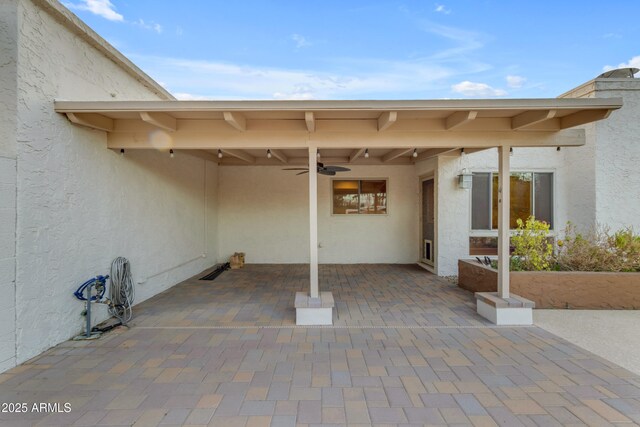 view of patio / terrace featuring ceiling fan