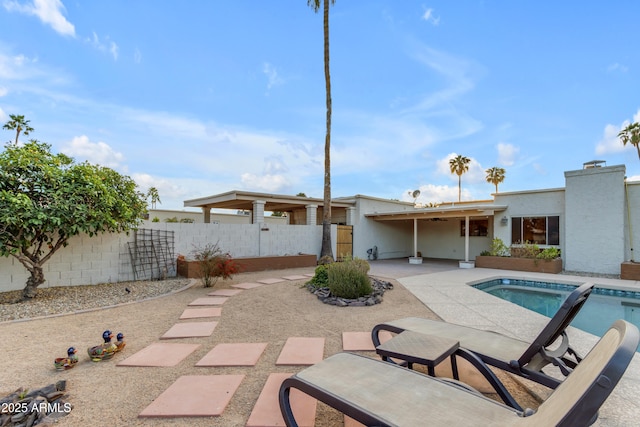 exterior space with a patio and a fenced in pool