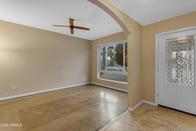 entrance foyer with ceiling fan