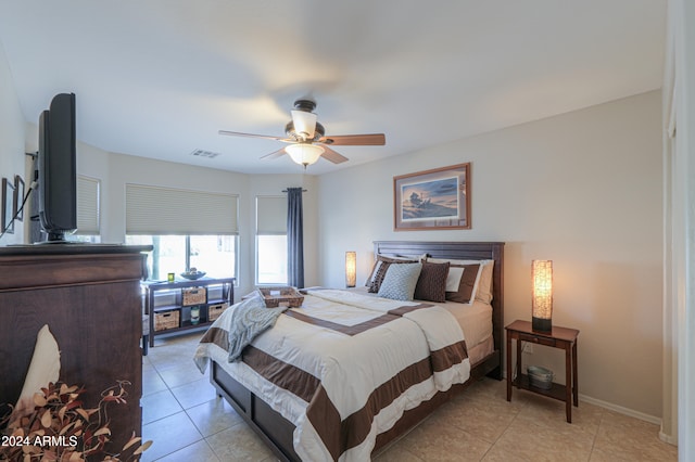 tiled bedroom with ceiling fan