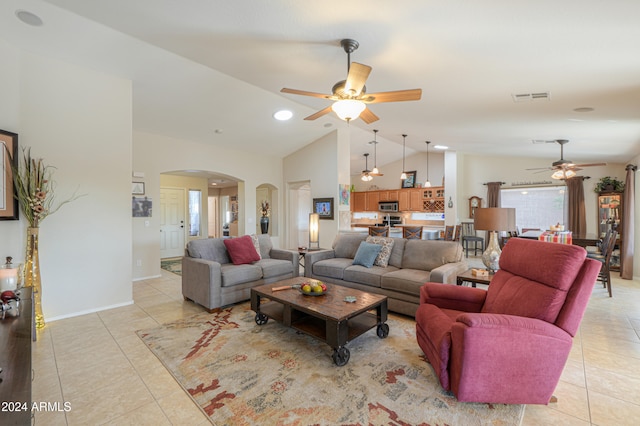 tiled living room with ceiling fan and lofted ceiling