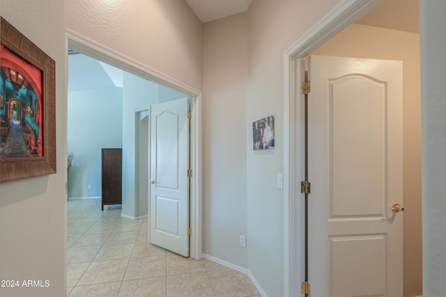 hallway with light tile patterned flooring