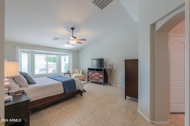 tiled bedroom featuring vaulted ceiling and ceiling fan