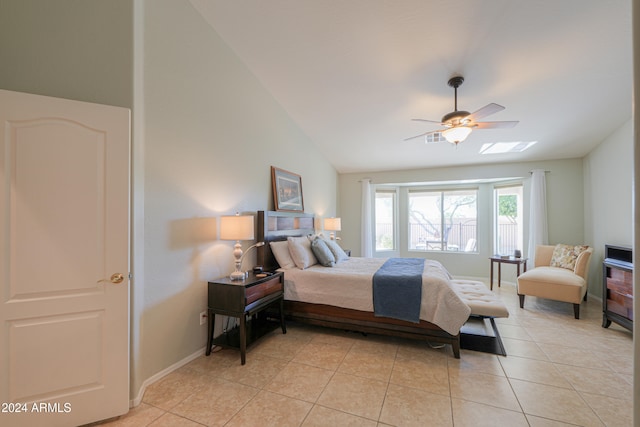 bedroom with light tile patterned floors, vaulted ceiling, and ceiling fan