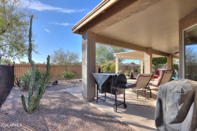 view of patio / terrace with a pergola and a grill