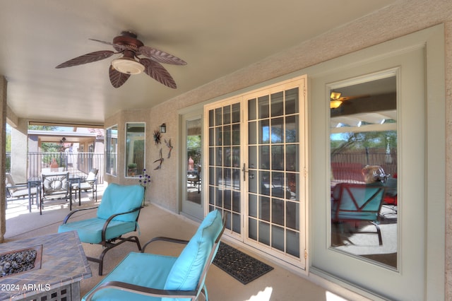 sunroom featuring ceiling fan