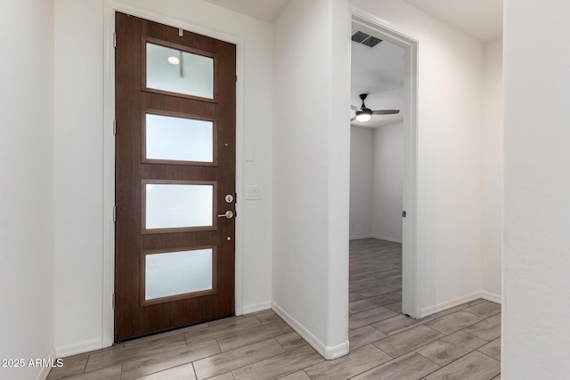 foyer featuring ceiling fan