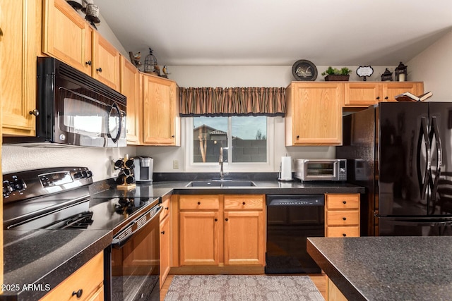 kitchen featuring black appliances, light hardwood / wood-style floors, and sink