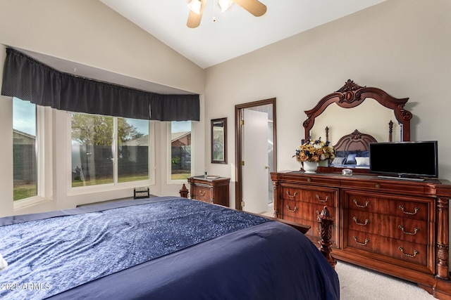 carpeted bedroom with ceiling fan and lofted ceiling