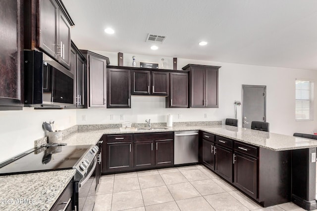 kitchen with stainless steel dishwasher, electric stove, a peninsula, a sink, and light tile patterned floors